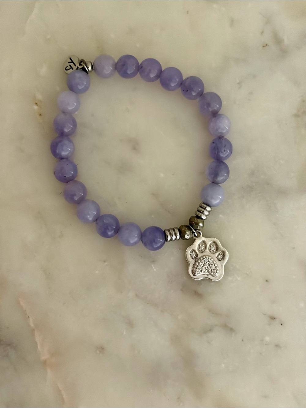 Hand crafted with semi precious stones and sterling silver paw charm.